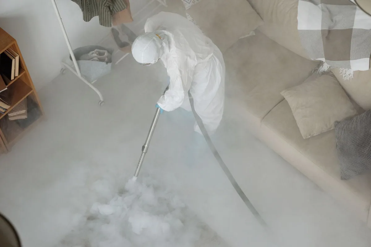 Biohazard cleanup technician in protective equipment, Longwood, Boston, MA